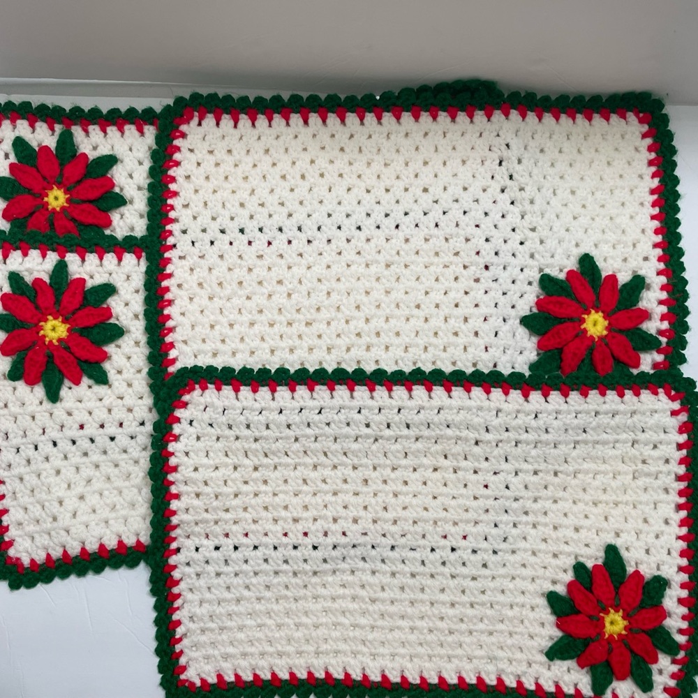 4 Vintage crocheted holiday placements with raised Poinsettia flower on each.
